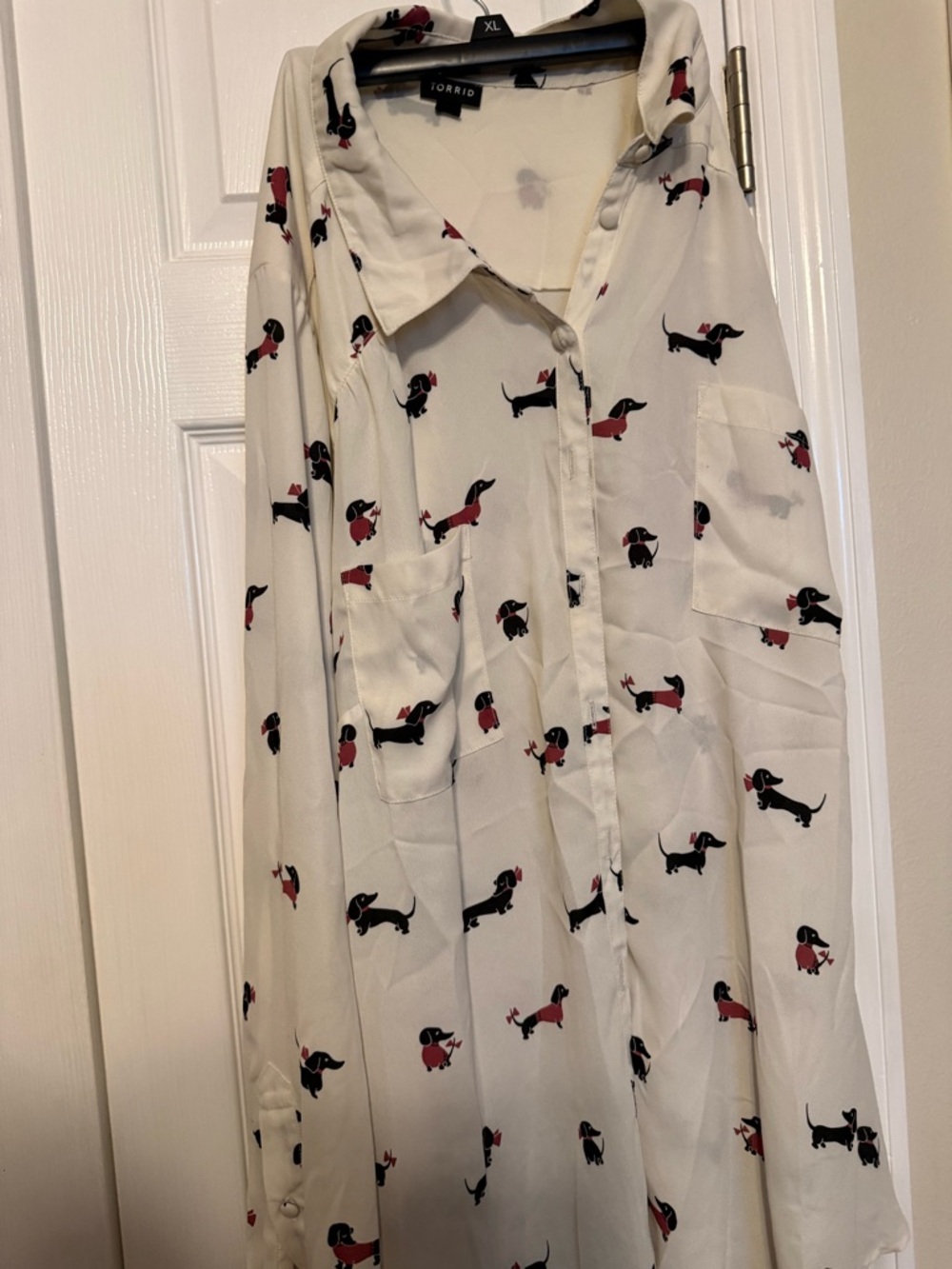 Torrid Black Logo Tag on Cream Garment